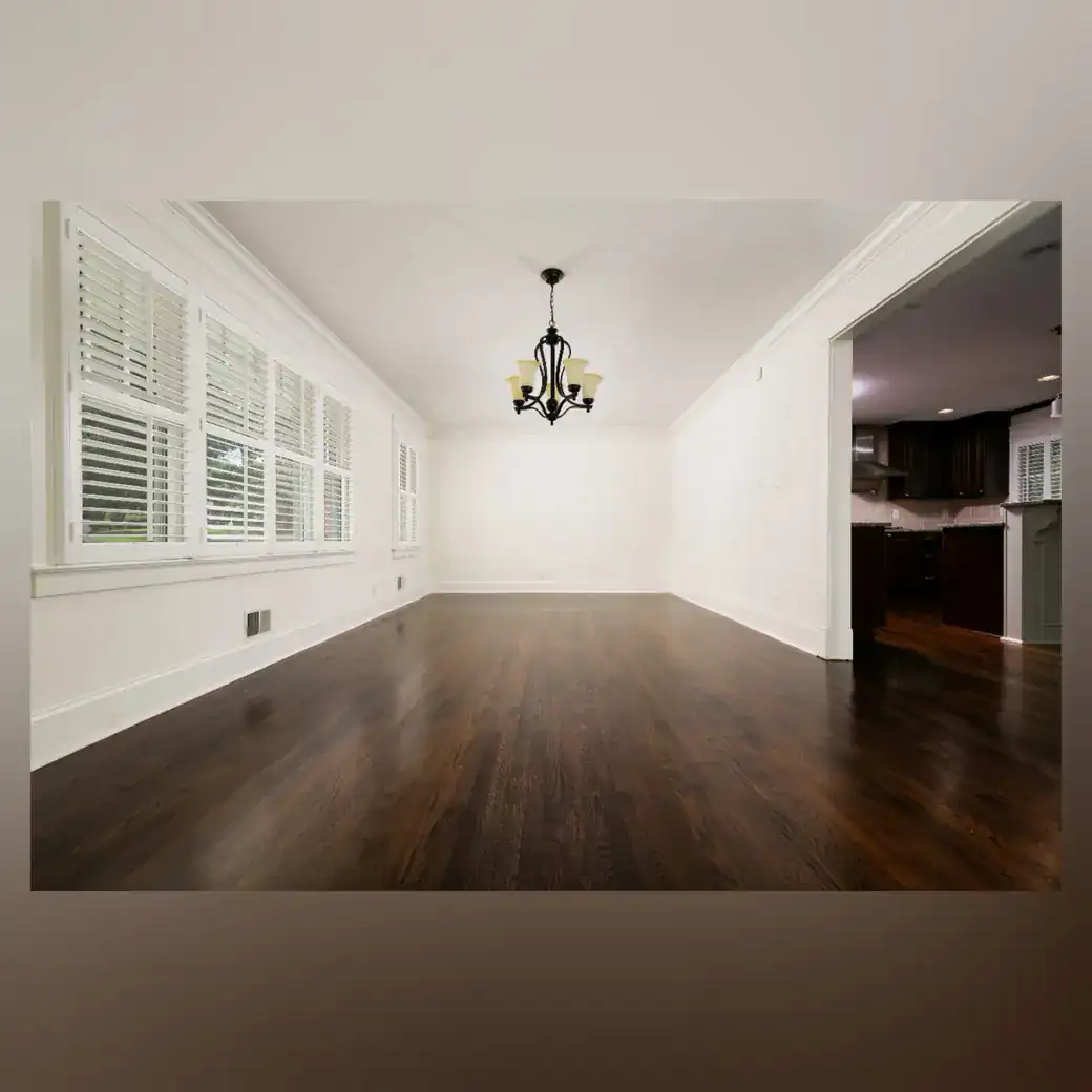 Finished dark hardwood flooring in a bright Metro Atlanta dining and living area