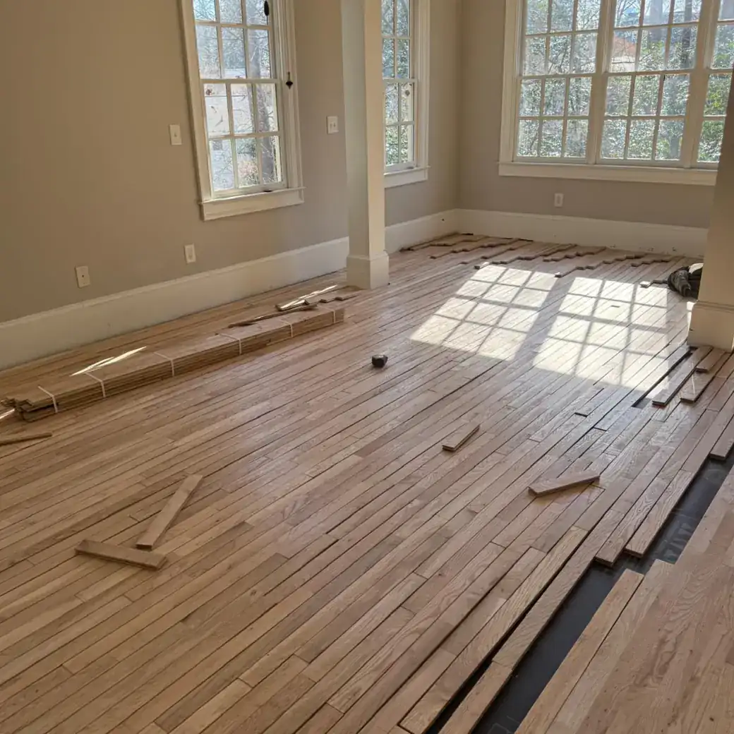 Hardwood flooring layout and installation in progress on a Metro Atlanta custom flooring project