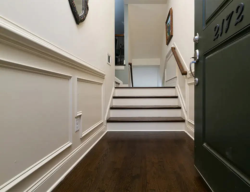 Finished hardwood foyer steps and staircase details in a Metro Atlanta home