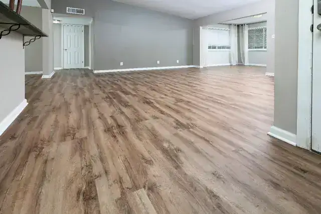 Completed wood-look luxury vinyl plank floor in a Final Floors Metro Atlanta living room